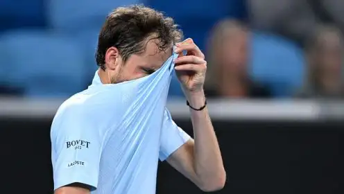 Pictured: Daniil Medvedev covers his face