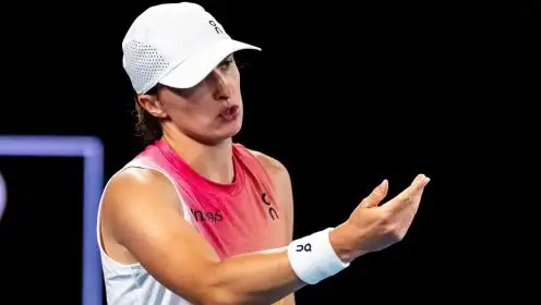 Pictured: Iga Swiatek looks on.