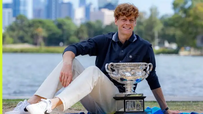 Jannik Sinner poses with the Australian Open trophy