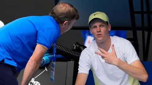 Pictured: Jannik Sinner speaks to a medic