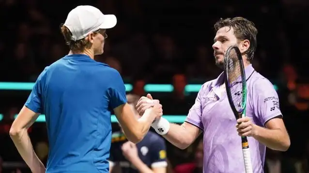 Stan Wawrinka with Jannik Sinner at the net