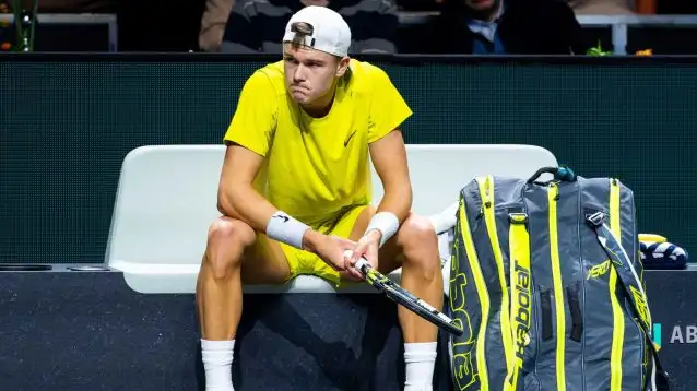 Holger Rune downbeat during a match