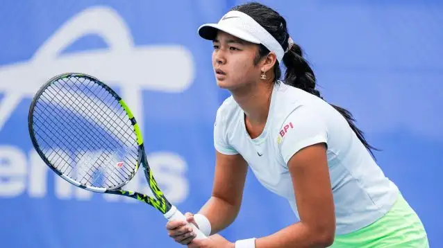 Pictured: Alex Eala waits to return a serve.