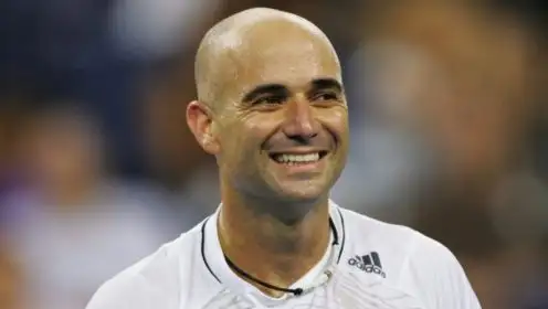 Andre Agassi smiles during a match