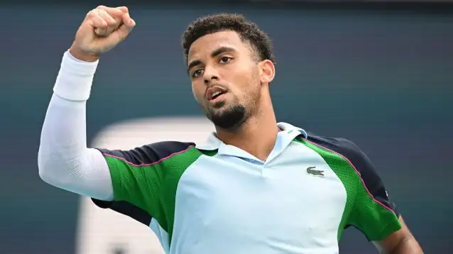 Arthur Fils celebrates during a match.