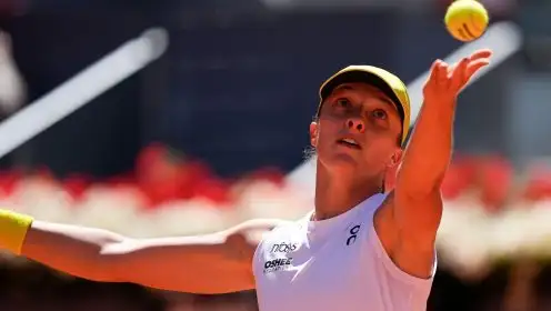 Pictured: Iga Swiatek hits a serve.