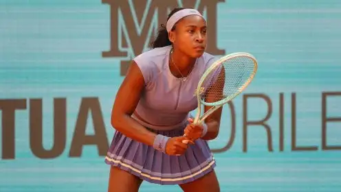 Coco Gauff returning a serve