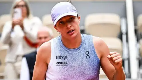 Pictured: Iga Swiatek fistpumps during a win.