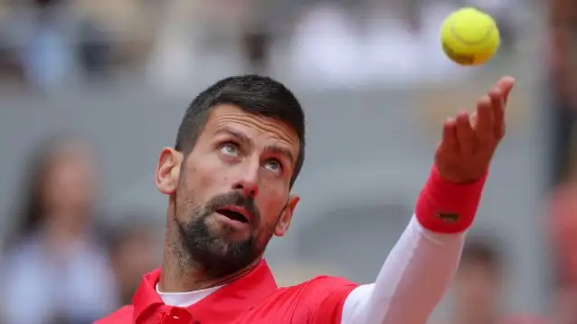 Pictured: Novak Djokovic prepares to serve.