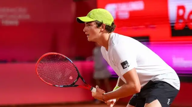 Joao Fonseca returning a serve