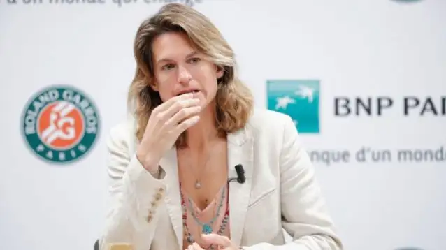 Amelie Mauresmo answers questions at a press conference.