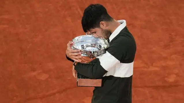 Pictured: Carlos Alcaraz with the French Open title.