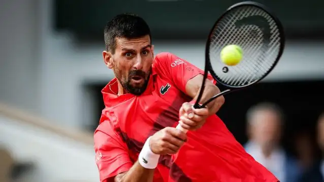 Pictured: Novak Djokovic hits a backhand