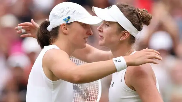 Pictured: Iga Swiatek and Elina Svitolina embrace.