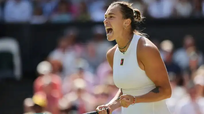 Aryna Sabalenka fistpumps during a match.