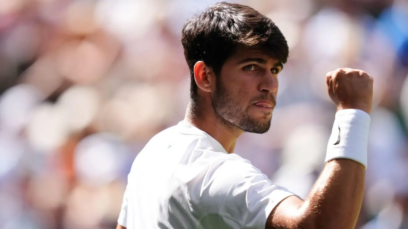 Pictured: Carlos Alcaraz fistpumps at Wimbledon.