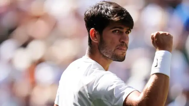 Pictured: Carlos Alcaraz fistpumps at Wimbledon.