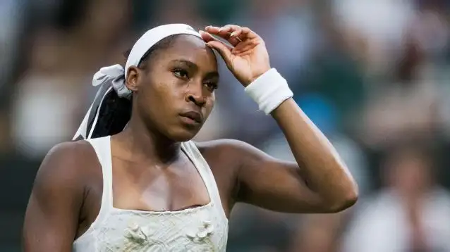 Coco Gauff looks on during a match.