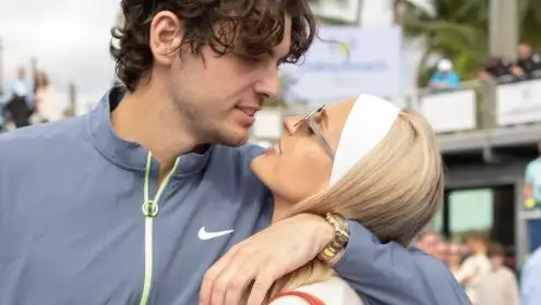 Taylor Fritz and Morgan Riddle embrace.