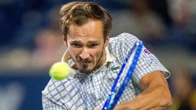 Daniil Medvedev hits a backhand.
